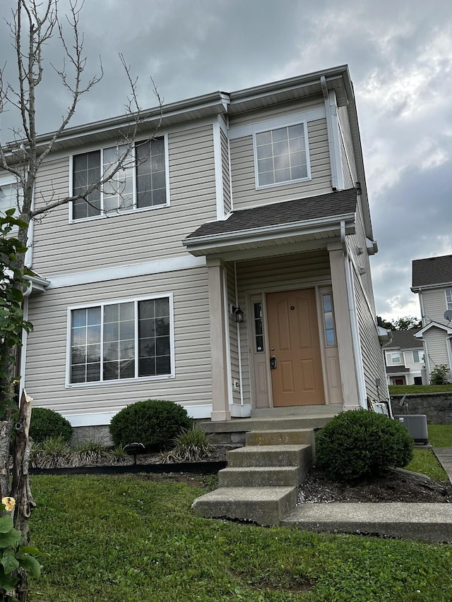 1213 Seminole Trl, Georgetown, KY 40324 - view of front facade with central air condition unit and a front yard