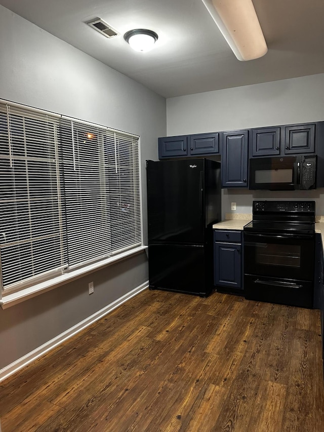 kitchen with black appliances, light countertops, dark wood finished floors, baseboards, and gray cabinets