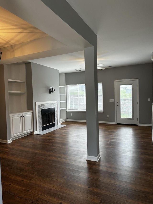 1213 Seminole Trl, Georgetown, KY 40324 - unfurnished living room featuring built in features, plenty of natural light, a fireplace, and baseboards