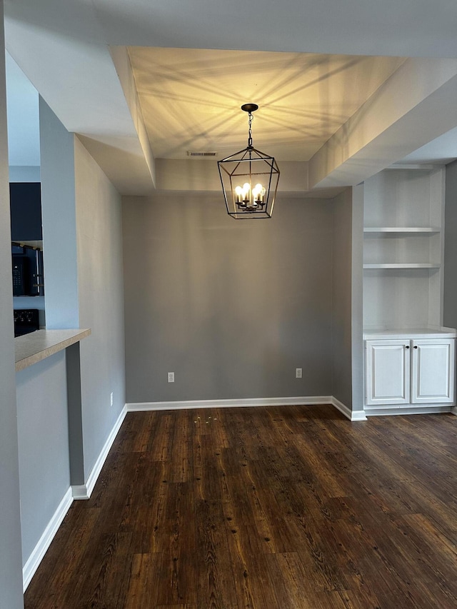 1213 Seminole Trl, Georgetown, KY 40324 - unfurnished dining area with dark wood-style floors, a chandelier, and baseboards
