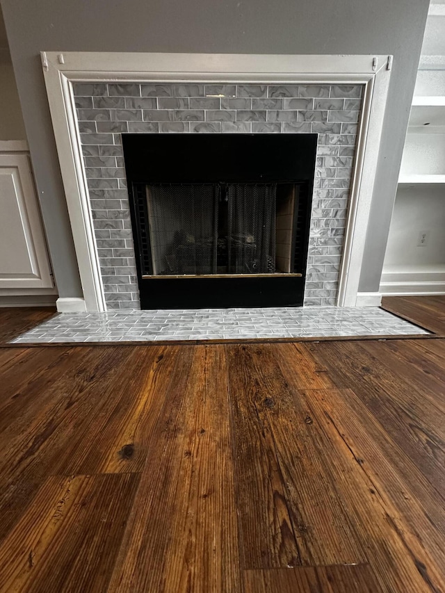 1213 Seminole Trl, Georgetown, KY 40324 - detailed view of a fireplace, wood finished floors, and baseboards