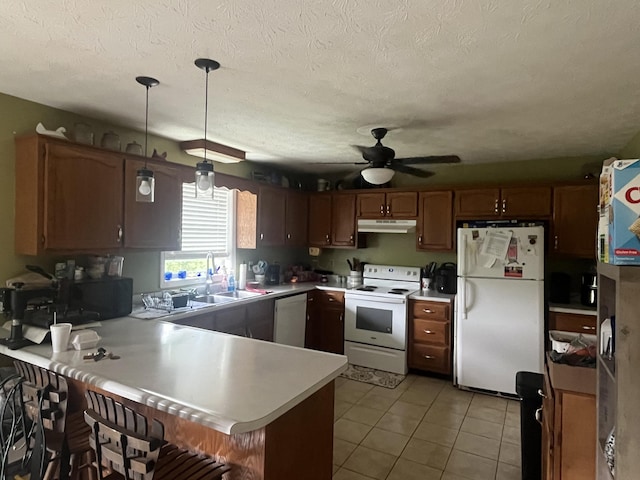 269 Old Somerset Rd, Mount Vernon, KY 40456 - kitchen featuring white appliances, a peninsula, light countertops, ceiling fan, and under cabinet range hood