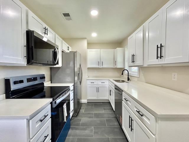 220 Jill Dr, Somerset, KY 42503 - kitchen with appliances with stainless steel finishes, a sink, recessed lighting, white cabinets, and light countertops