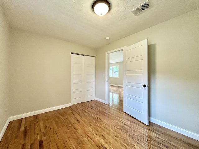 220 Jill Dr, Somerset, KY 42503 - unfurnished bedroom featuring baseboards, light wood-style floors, and a closet