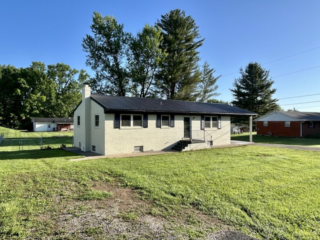 220 Jill Dr, Somerset, KY 42503 - view of front of home with a chimney, brick siding, metal roof, and a front yard