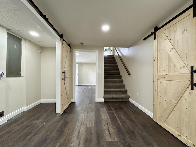 220 Jill Dr, Somerset, KY 42503 - finished below grade area featuring a barn door, wood finished floors, baseboards, and stairway