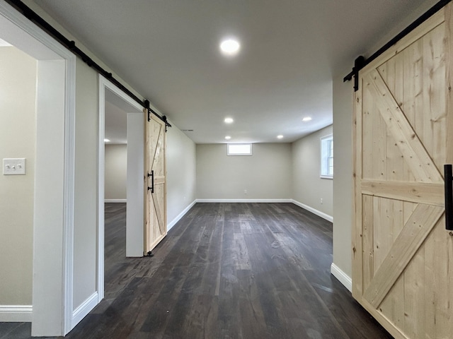 220 Jill Dr, Somerset, KY 42503 - basement with a barn door, baseboards, dark wood-type flooring, and recessed lighting