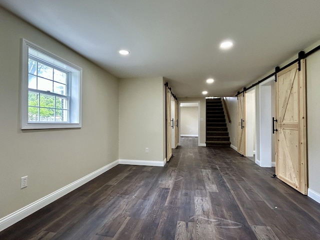 220 Jill Dr, Somerset, KY 42503 - basement with a barn door, dark wood-type flooring, baseboards, recessed lighting, and stairway