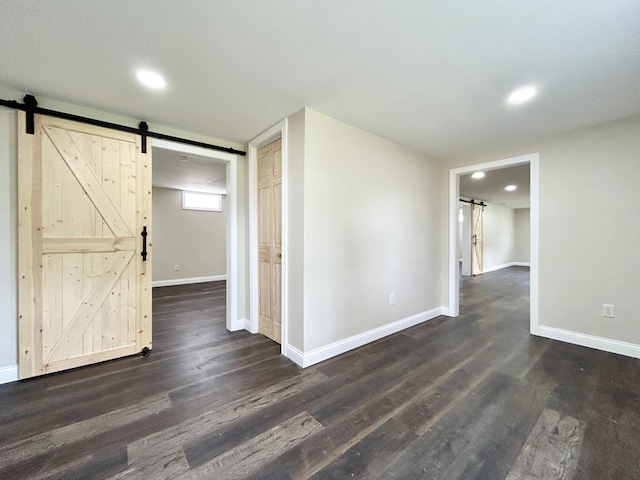 220 Jill Dr, Somerset, KY 42503 - spare room with a barn door, dark wood-style floors, baseboards, and recessed lighting