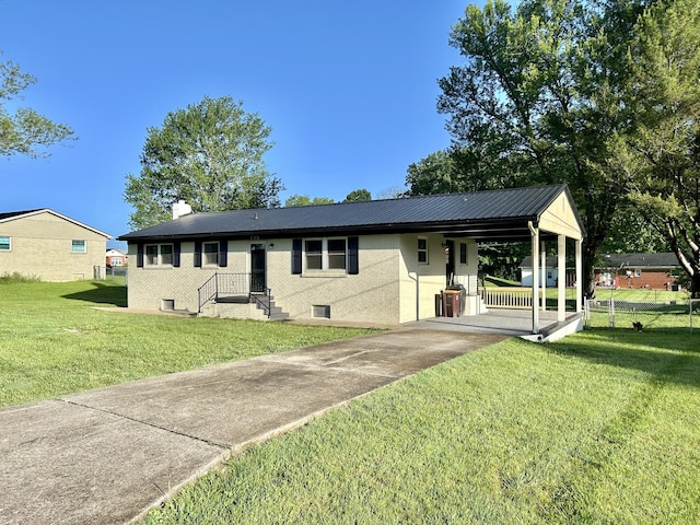 220 Jill Dr, Somerset, KY 42503 - ranch-style house with a front lawn, a chimney, metal roof, and driveway