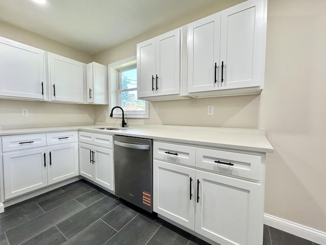 220 Jill Dr, Somerset, KY 42503 - kitchen featuring stainless steel dishwasher, a sink, white cabinetry, light countertops, and baseboards
