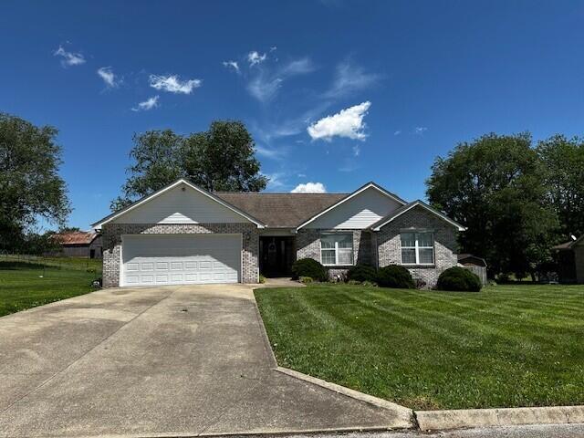 76 Waterford Way, Somerset, KY 42501 - single story home featuring an attached garage, concrete driveway, a front lawn, and brick siding