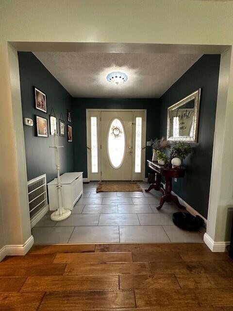 76 Waterford Way, Somerset, KY 42501 - entrance foyer with wood finished floors, baseboards, and a textured ceiling