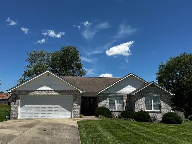 76 Waterford Way, Somerset, KY 42501 - ranch-style house with brick siding, concrete driveway, an attached garage, and a front lawn