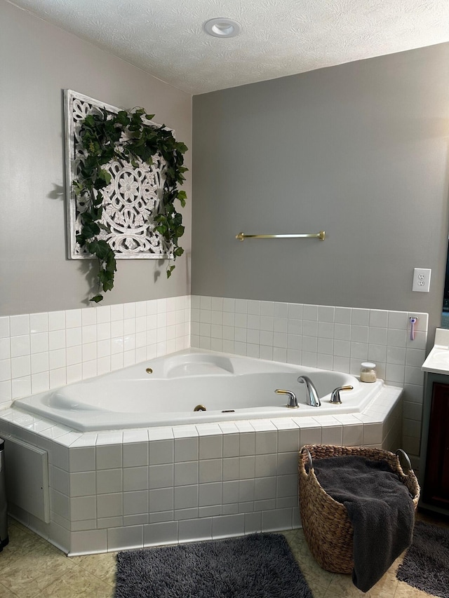 76 Waterford Way, Somerset, KY 42501 - bathroom with vanity, a tub with jets, a textured ceiling, and tile patterned floors