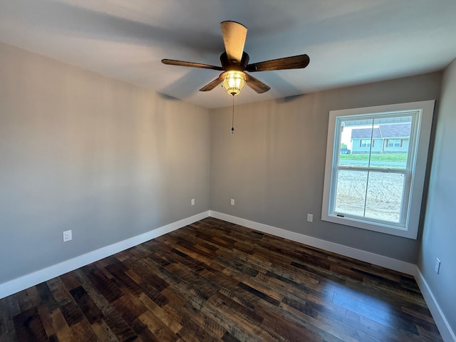 10 Nolan Dr, Corbin, KY 40701 - spare room featuring dark wood finished floors, a ceiling fan, and baseboards
