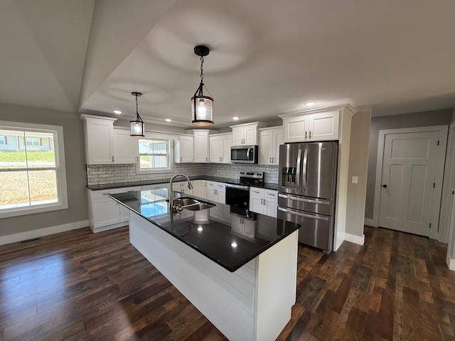 10 Nolan Dr, Corbin, KY 40701 - kitchen featuring appliances with stainless steel finishes, dark countertops, baseboards, backsplash, and recessed lighting