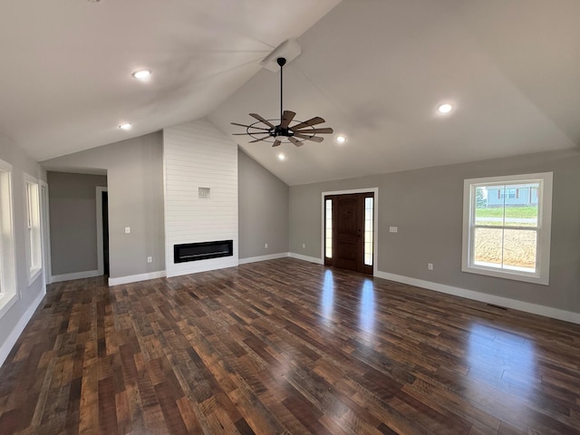 10 Nolan Dr, Corbin, KY 40701 - unfurnished living room featuring vaulted ceiling, a ceiling fan, dark wood-style floors, a fireplace, and baseboards