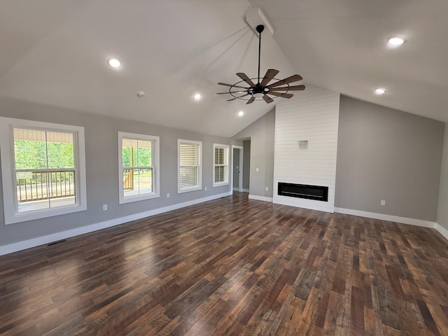 10 Nolan Dr, Corbin, KY 40701 - unfurnished living room with a ceiling fan, vaulted ceiling, dark wood-style flooring, baseboards, and a large fireplace
