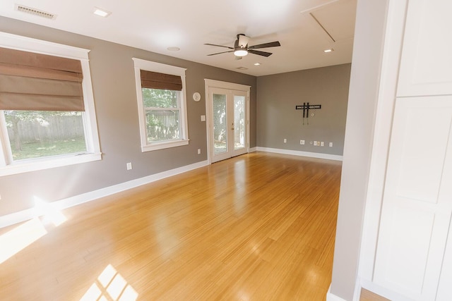 1010 Aurora Ave, Lexington, KY 40502 - spare room featuring a ceiling fan, light wood-style flooring, baseboards, and attic access