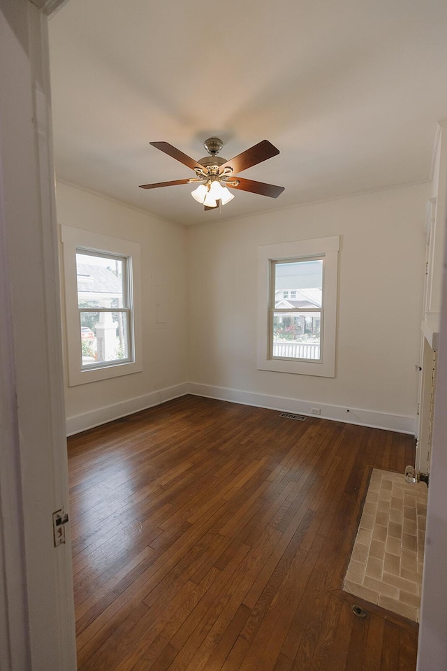 1010 Aurora Ave, Lexington, KY 40502 - empty room featuring healthy amount of natural light, dark wood-style flooring, baseboards, and ceiling fan