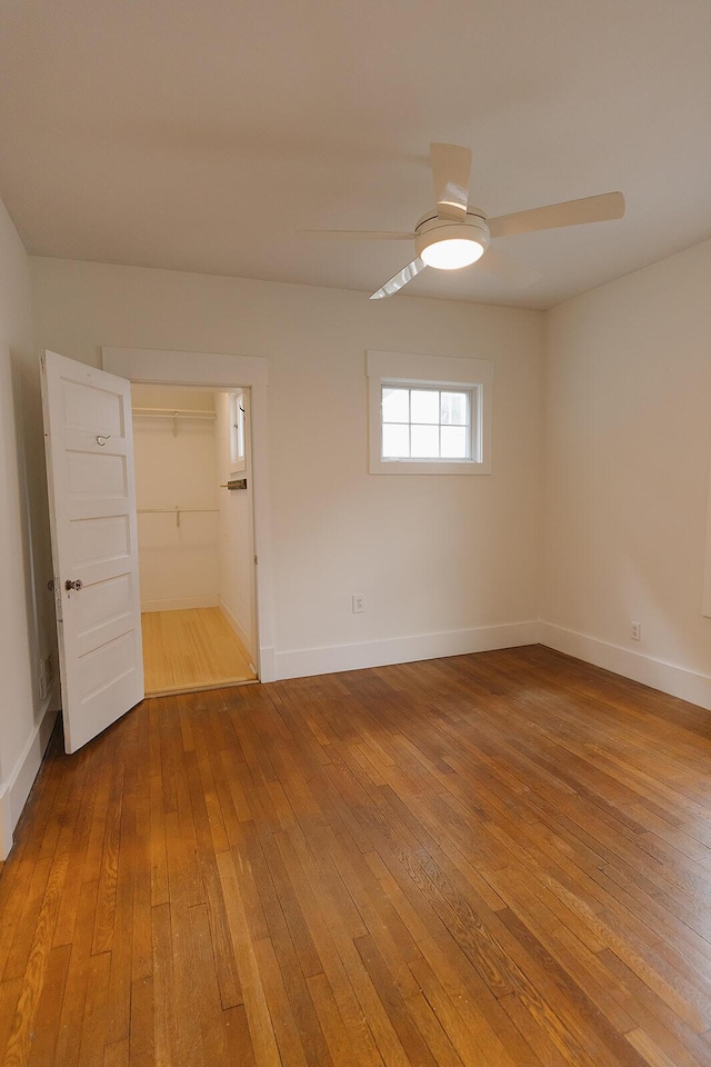 1010 Aurora Ave, Lexington, KY 40502 - spare room featuring wood-type flooring, a ceiling fan, and baseboards
