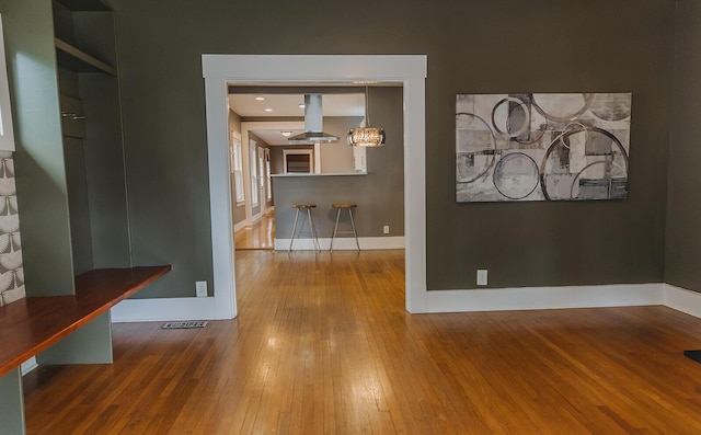 1010 Aurora Ave, Lexington, KY 40502 - unfurnished dining area featuring hardwood / wood-style flooring and baseboards