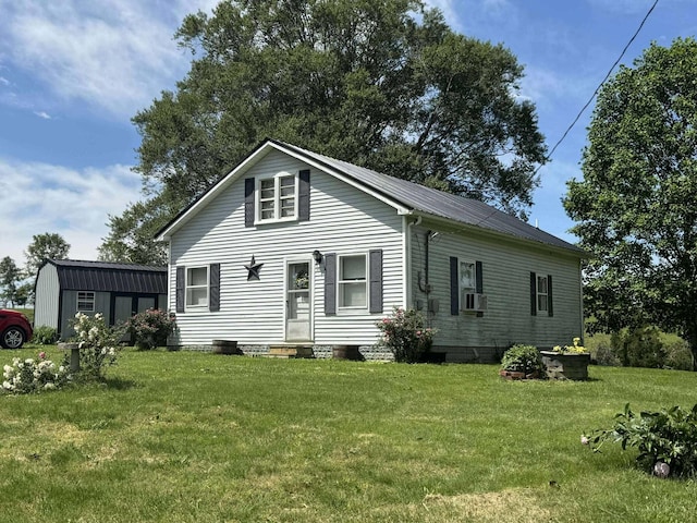605 Sticks Rd, Jamestown, KY 42629 - view of front of property featuring entry steps, a front yard, metal roof, an outbuilding, and a storage unit