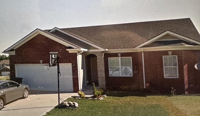 109 Rich Ln, Georgetown, KY 40324 - view of front of house with brick siding, driveway, a front lawn, and a garage