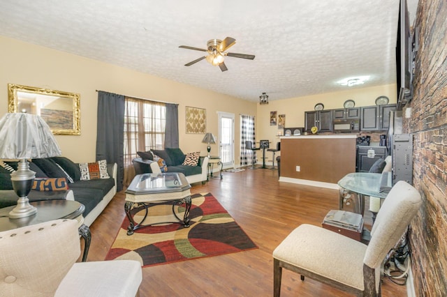 109 Rich Ln, Georgetown, KY 40324 - living room featuring a textured ceiling, ceiling fan, and wood finished floors
