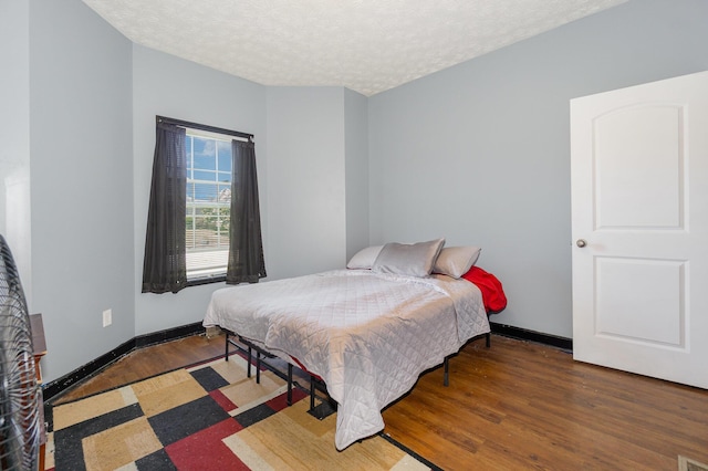 109 Rich Ln, Georgetown, KY 40324 - bedroom with wood finished floors, a textured ceiling, and baseboards