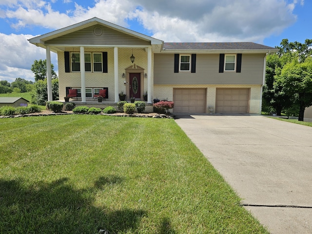 87 Park Estates Ln, London, KY 40744 - bi-level home featuring covered porch, brick siding, a garage, concrete driveway, and a front lawn