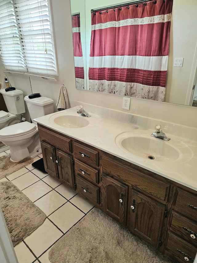 87 Park Estates Ln, London, KY 40744 - bathroom featuring toilet, double vanity, and tile patterned flooring