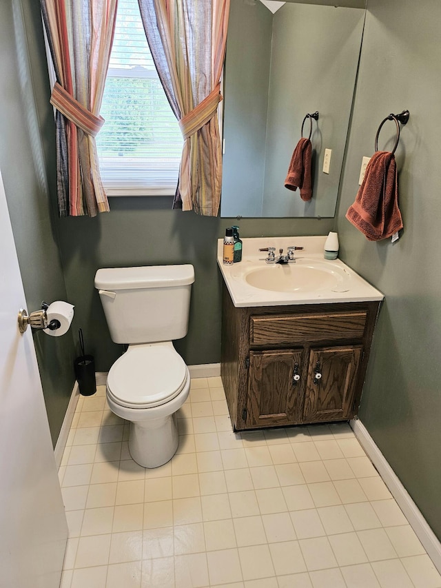 87 Park Estates Ln, London, KY 40744 - half bathroom with toilet, baseboards, vanity, and tile patterned floors