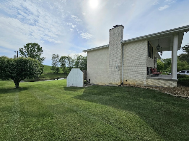 87 Park Estates Ln, London, KY 40744 - view of grassy yard featuring a water view and a patio