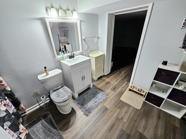 87 Park Estates Ln, London, KY 40744 - bathroom with toilet, vanity, and wood finished floors