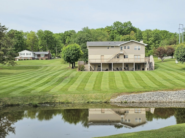 87 Park Estates Ln, London, KY 40744 - back of property with stairway, a deck with water view, and a yard