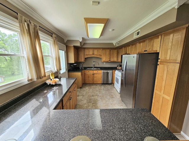 87 Park Estates Ln, London, KY 40744 - kitchen with appliances with stainless steel finishes, a sink, crown molding, dark stone counters, and brown cabinetry