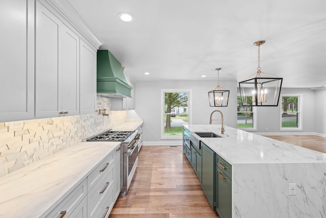 810 Cooper Dr, Lexington, KY 40502 - kitchen featuring custom range hood, stainless steel appliances, recessed lighting, baseboards, and a sink