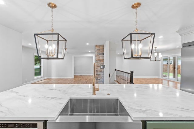 810 Cooper Dr, Lexington, KY 40502 - kitchen featuring a chandelier, a sink, light stone countertops, recessed lighting, and light wood-style floors