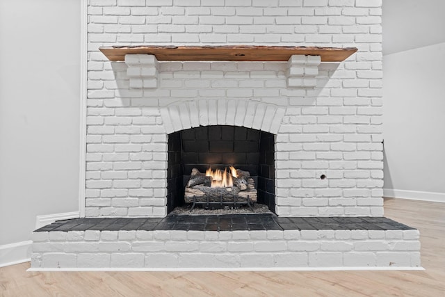 810 Cooper Dr, Lexington, KY 40502 - detailed view of wood finished floors, baseboards, and a fireplace
