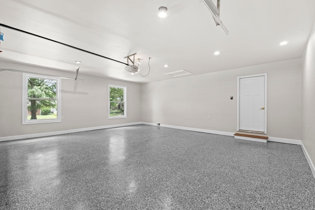 810 Cooper Dr, Lexington, KY 40502 - garage with a garage door opener, baseboards, and recessed lighting