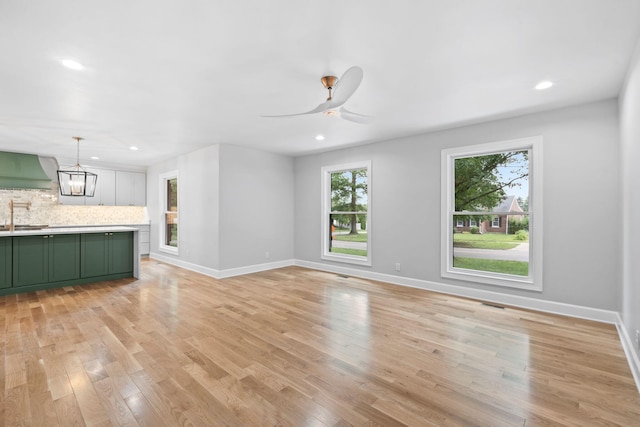 810 Cooper Dr, Lexington, KY 40502 - unfurnished living room with light wood-style flooring, a sink, baseboards, recessed lighting, and a ceiling fan
