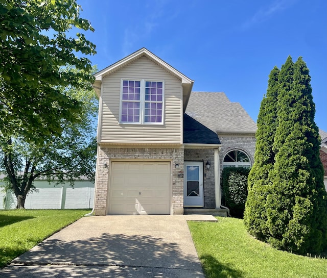 812 Statesman Way, Lexington, KY 40505 - view of front facade with brick siding, concrete driveway, roof with shingles, and a front yard