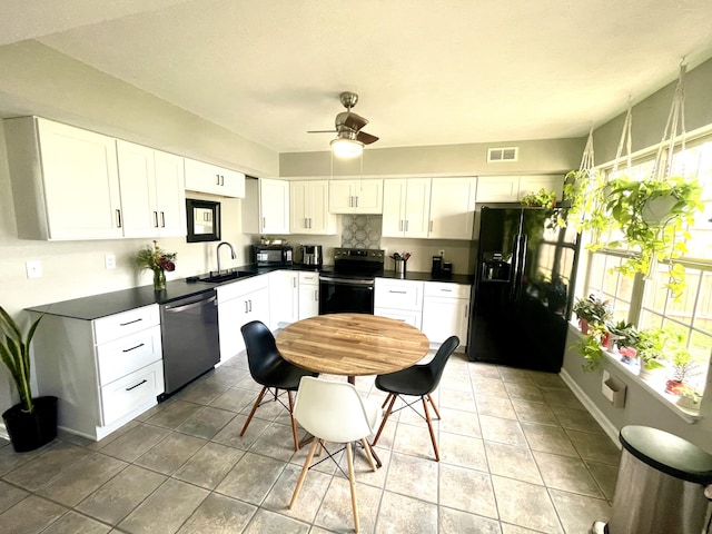 812 Statesman Way, Lexington, KY 40505 - kitchen with black appliances, dark countertops, ceiling fan, and white cabinets