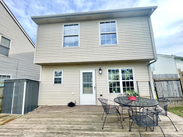 812 Statesman Way, Lexington, KY 40505 - back of house featuring a storage shed, a deck, an outbuilding, fence, and outdoor dining area