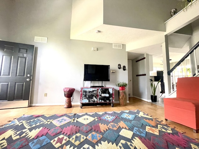 812 Statesman Way, Lexington, KY 40505 - living area with wood finished floors, baseboards, and stairway