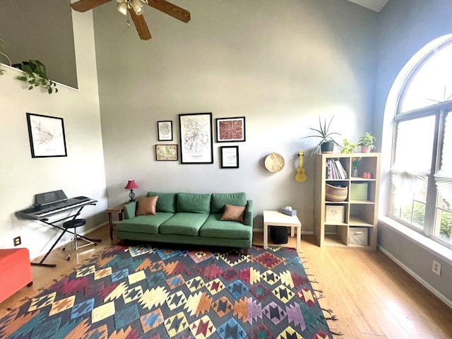 812 Statesman Way, Lexington, KY 40505 - living room with wood finished floors, a ceiling fan, baseboards, and a high ceiling
