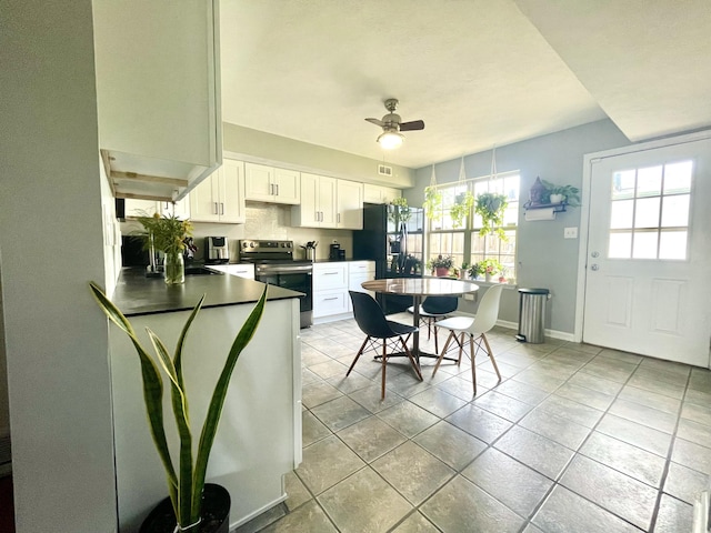 812 Statesman Way, Lexington, KY 40505 - kitchen featuring stainless steel electric range, ceiling fan, dark countertops, white cabinets, and baseboards