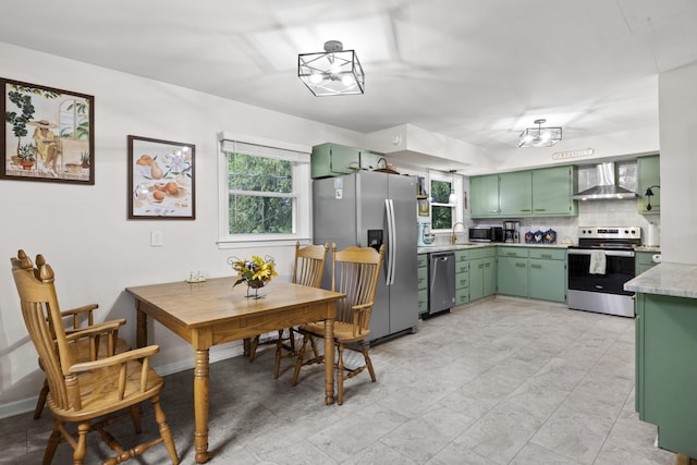 3488 Elmendorf Way, Lexington, KY 40517 - kitchen with appliances with stainless steel finishes, green cabinets, and wall chimney exhaust hood